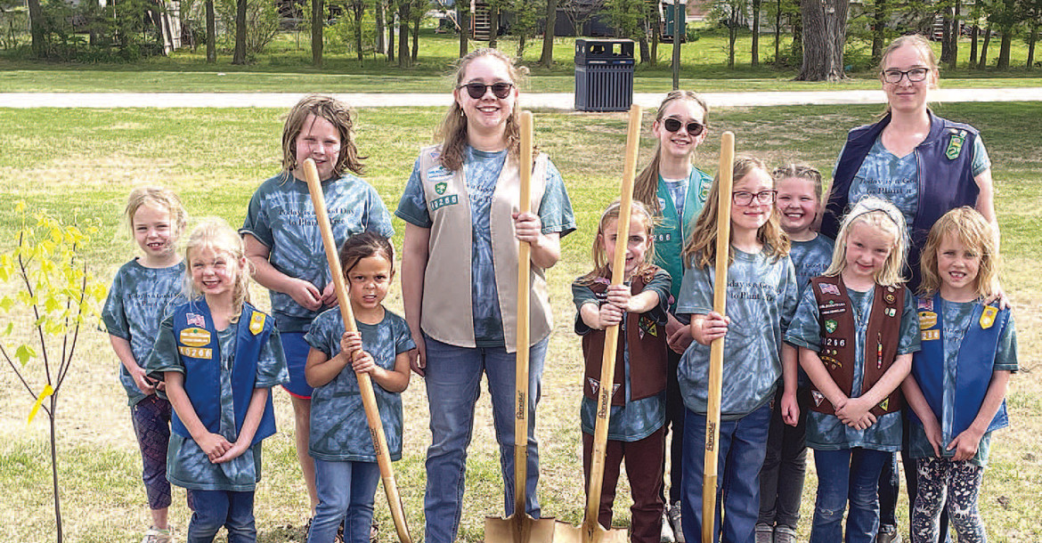 Members of Girl Scout Troop 40266 in Goddard celebrated Earth Day with a tree planting and marked the upcoming Neighbors United with a ribbon cutting. The Scouts had a ceremonial turning of the dirt as well. Travis Mounts/TSnews